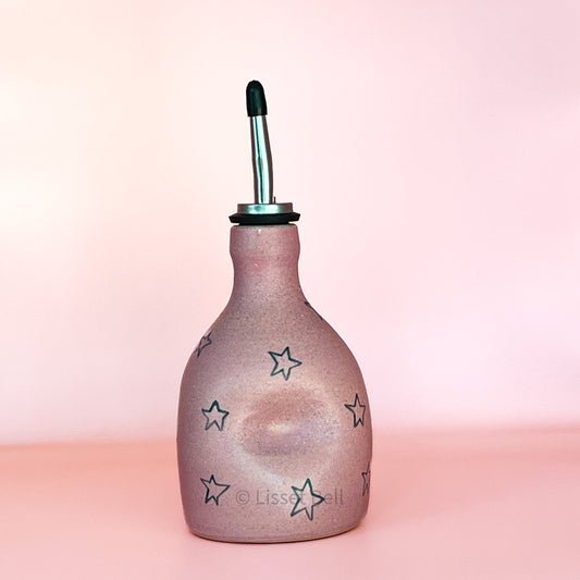 Pink oil bottle